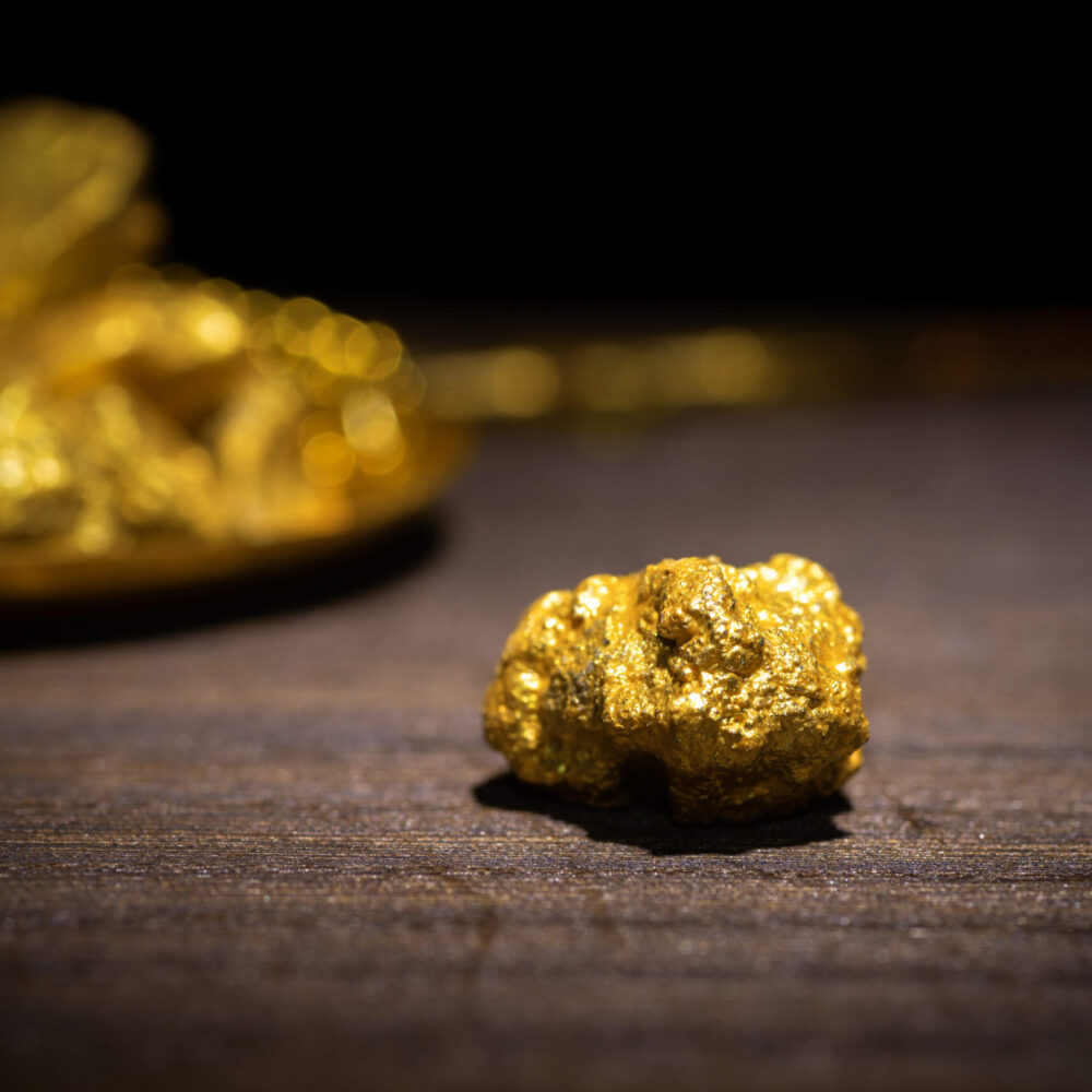 Gold concept, close-up of large gold nuggets Gold concept, close-up of large gold nuggets
